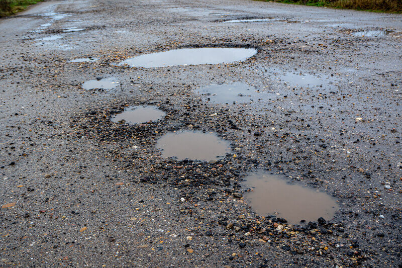 Potholes in road